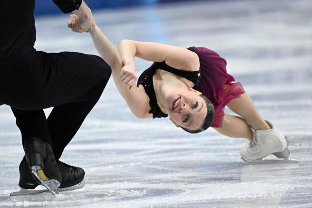 Poland's Ioulia Chtchetinina and Poland's Michal Wozniak compete in the figure skating pair skating free skating final during the Milano Cortina 2026 Winter Olympic Games at Milano Ice Skating Arena in Milan on February 16, 2026. (Photo by WANG Zhao / AFP)