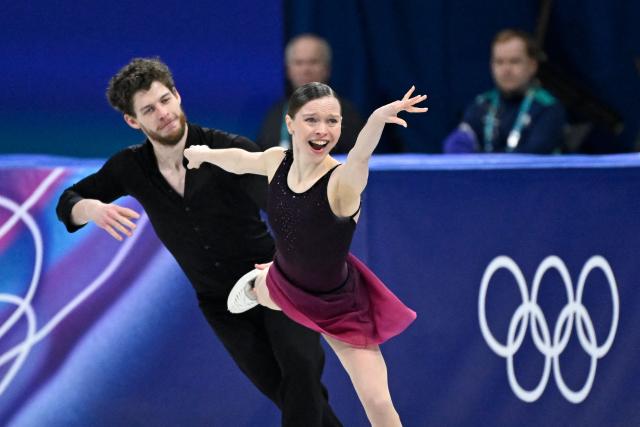 Poland's Ioulia Chtchetinina and Poland's Michal Wozniak compete in the figure skating pair skating free skating final during the Milano Cortina 2026 Winter Olympic Games at Milano Ice Skating Arena in Milan on February 16, 2026. (Photo by WANG Zhao / AFP)