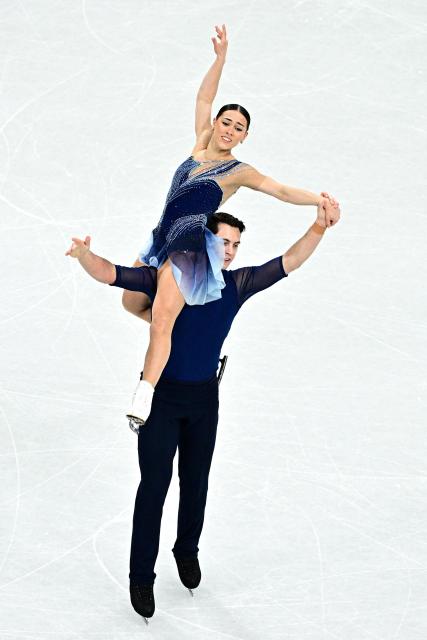 Britain's Anastasia Vaipan-Law and Luke Digby compete in the figure skating pair skating free skating final during the Milano Cortina 2026 Winter Olympic Games at Milano Ice Skating Arena in Milan on February 16, 2026. (Photo by JULIEN DE ROSA / AFP)