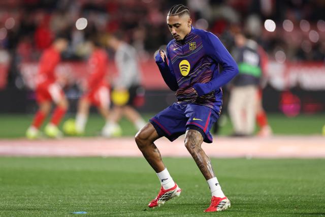 Barcelona's Brazilian forward #11 Raphinha warms up ahead of the Spanish league football match between Girona FC and FC Barcelona at Montilivi Stadium in Girona on February 16, 2026. (Photo by Josep LAGO / AFP)