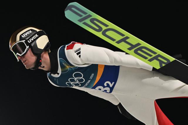 Norway's Kristoffer Eriksen Sundal jumps during the first round of the men's large hill super team ski jumping of the Milano Cortina 2026 Winter Olympic Games at Predazzo Ski Jumping Stadium in Predazzo (Val di Fiemme), on February 16, 2026. (Photo by Javier SORIANO / AFP)