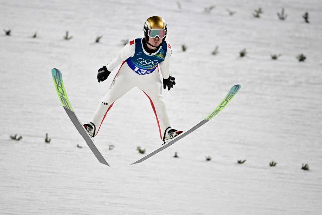 Norway's Kristoffer Eriksen Sundal jumps during the second round of the men's large hill super team ski jumping of the Milano Cortina 2026 Winter Olympic Games at Predazzo Ski Jumping Stadium in Predazzo (Val di Fiemme), on February 16, 2026. (Photo by Tobias SCHWARZ / AFP)