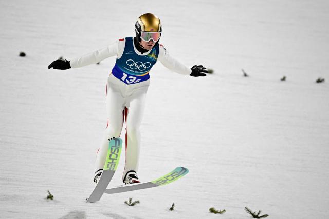 Norway's Kristoffer Eriksen Sundal lands during a jump during the second round of the men's large hill super team ski jumping of the Milano Cortina 2026 Winter Olympic Games at Predazzo Ski Jumping Stadium in Predazzo (Val di Fiemme), on February 16, 2026. (Photo by Tobias SCHWARZ / AFP)