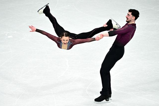 TOPSHOT - Germany's Annika Hocke and Robert Kunkel compete in the figure skating pair skating free skating final during the Milano Cortina 2026 Winter Olympic Games at Milano Ice Skating Arena in Milan on February 16, 2026. (Photo by JULIEN DE ROSA / AFP)