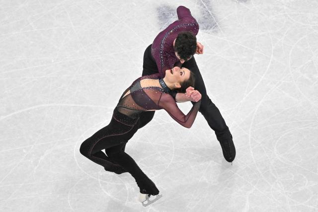 Germany's Annika Hocke and Germany's Robert Kunkel compete in the figure skating pair skating free skating final during the Milano Cortina 2026 Winter Olympic Games at Milano Ice Skating Arena in Milan on February 16, 2026. (Photo by Antonin THUILLIER / AFP)