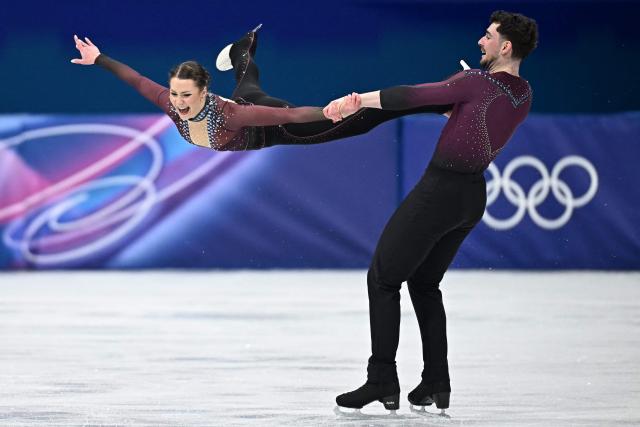 Germany's Annika Hocke and Germany's Robert Kunkel compete in the figure skating pair skating free skating final during the Milano Cortina 2026 Winter Olympic Games at Milano Ice Skating Arena in Milan on February 16, 2026. (Photo by Gabriel BOUYS / AFP)