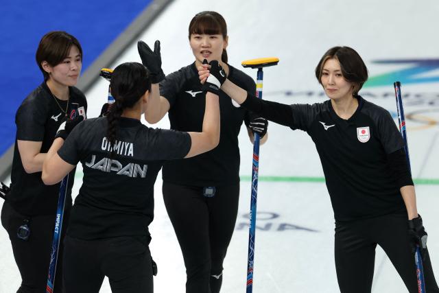 (From L) Japan's Kaho Onodera, Japan's Anna Ohmiya, Japan's Yuna Kotani and Japan's Sayaka Yoshimura compete in the curling women's round robin between Japan and Canada during the Milano Cortina 2026 Winter Olympic Games at the Cortina Curling Olympic Stadium in Cortina d’Ampezzo on February 16, 2026. (Photo by Odd ANDERSEN / AFP)