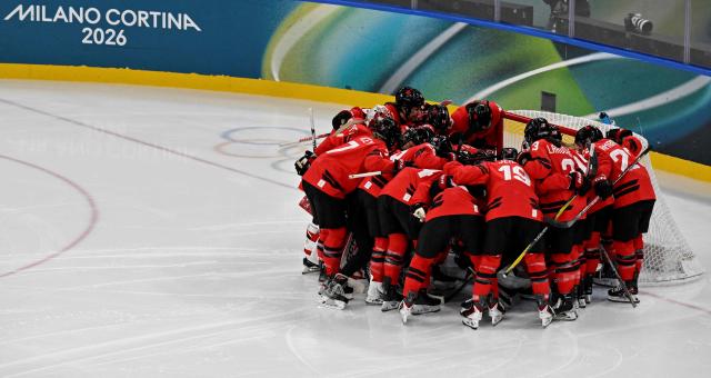 Canada's teammates gather prior to the women's play-off semi-final ice hockey match between Canada and Switzerland at the Milano Santagiulia Ice Hockey Arena during the Milano Cortina 2026 Winter Olympic Games in Milan, on February 16, 2026. (Photo by Alexander NEMENOV / AFP)