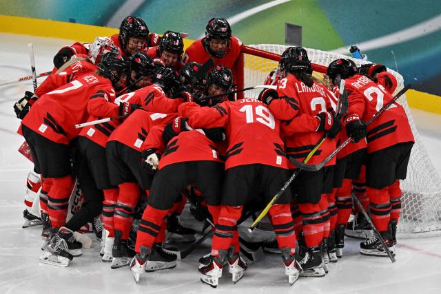 Canada's teammates gather prior to the women's play-off semi-final ice hockey match between Canada and Switzerland at the Milano Santagiulia Ice Hockey Arena during the Milano Cortina 2026 Winter Olympic Games in Milan, on February 16, 2026. (Photo by Alexander NEMENOV / AFP)