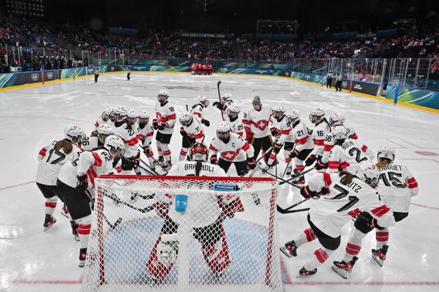 Switzerland's teammates gather prior to the women's play-off semi-final ice hockey match between Canada and Switzerland at the Milano Santagiulia Ice Hockey Arena during the Milano Cortina 2026 Winter Olympic Games in Milan, on February 16, 2026. (Photo by Alexander NEMENOV / POOL / AFP)