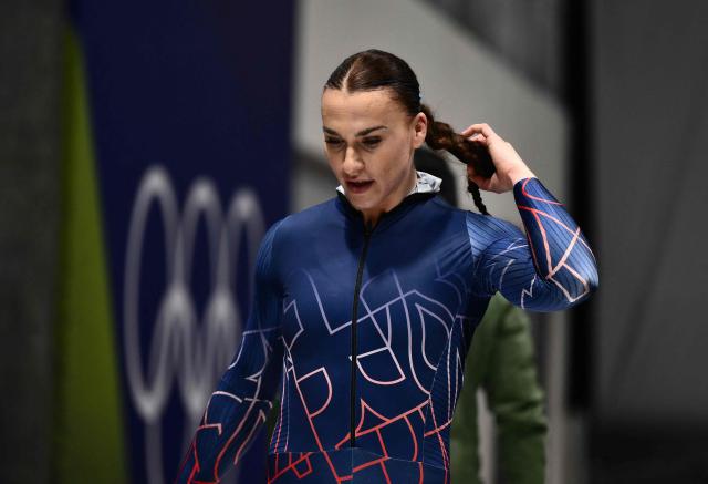 Britain's Adele Nicoll reacts after competing in the bobsleigh women's monobob heat 4 at Cortina Sliding Centre during the Milano Cortina 2026 Winter Olympic Games in Cortina d'Ampezzo on February 16, 2026. (Photo by Marco BERTORELLO / AFP)