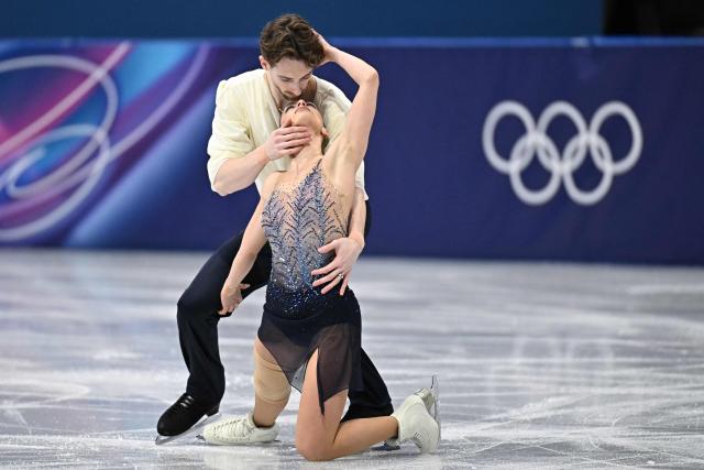 Italy's Sara Conti and Italy's Niccolo Macii compete in the figure skating pair skating free skating final during the Milano Cortina 2026 Winter Olympic Games at Milano Ice Skating Arena in Milan on February 16, 2026. (Photo by Gabriel BOUYS / AFP)