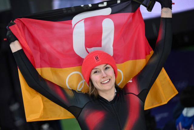 Germany's Laura Nolte celebrates after winning silver in the bobsleigh women's monobob heat 4 at Cortina Sliding Centre during the Milano Cortina 2026 Winter Olympic Games in Cortina d'Ampezzo on February 16, 2026. (Photo by Marco BERTORELLO / AFP)
