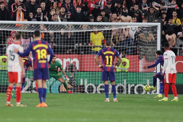 Barcelona's Spanish forward #10 Lamine Yamal fails to score a penalty kick during the Spanish league football match between Girona FC and FC Barcelona at Montilivi Stadium in Girona on February 16, 2026. (Photo by Josep LAGO / AFP)