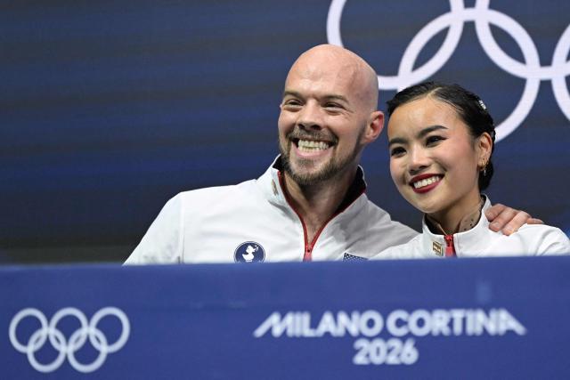 USA's Ellie Kam and USA's Danny O'Shea react in the kiss and cry area after competing in the figure skating pair skating free skating final during the Milano Cortina 2026 Winter Olympic Games at Milano Ice Skating Arena in Milan on February 16, 2026. (Photo by Gabriel BOUYS / AFP)