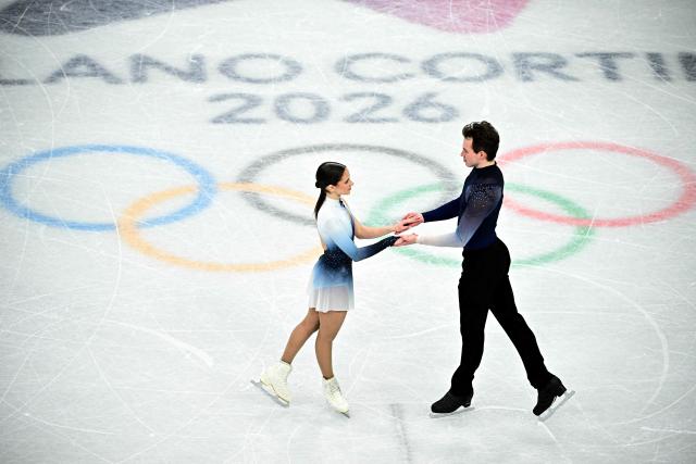 Hungary's Maria Pavlova and Alexsei Sviatchenko compete in the figure skating pair skating free skating final during the Milano Cortina 2026 Winter Olympic Games at Milano Ice Skating Arena in Milan on February 16, 2026. (Photo by JULIEN DE ROSA / AFP)