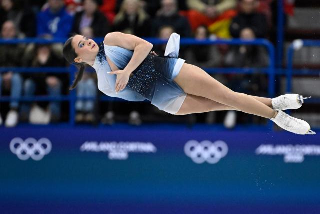 Hungary's Maria Pavlova and Hungary's Alexei Sviatchenko compete in the figure skating pair skating free skating final during the Milano Cortina 2026 Winter Olympic Games at Milano Ice Skating Arena in Milan on February 16, 2026. (Photo by WANG Zhao / AFP)
