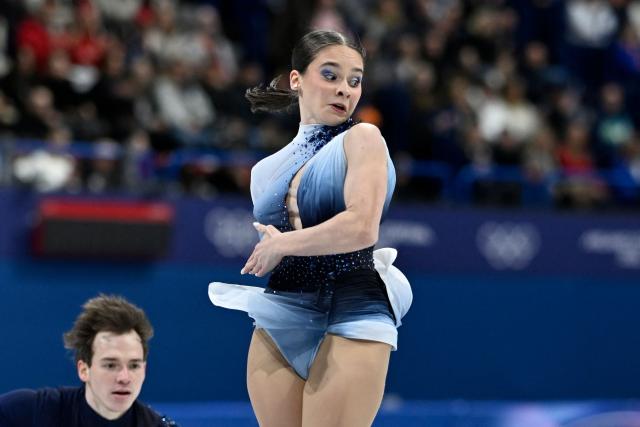 Hungary's Maria Pavlova and Hungary's Alexei Sviatchenko compete in the figure skating pair skating free skating final during the Milano Cortina 2026 Winter Olympic Games at Milano Ice Skating Arena in Milan on February 16, 2026. (Photo by WANG Zhao / AFP)