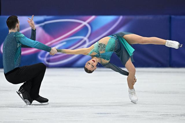 Georgia's Anastasiia Metelkina and Georgia's Luka Berulava compete in the figure skating pair skating free skating final during the Milano Cortina 2026 Winter Olympic Games at Milano Ice Skating Arena in Milan on February 16, 2026. (Photo by Gabriel BOUYS / AFP)