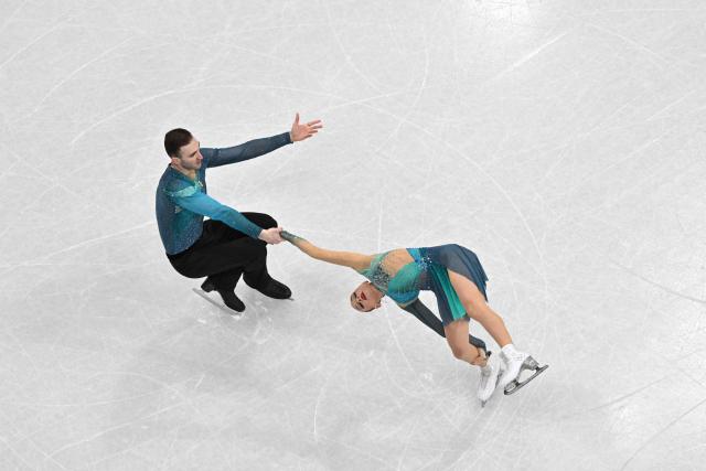 Georgia's Anastasiia Metelkina and Georgia's Luka Berulava compete in the figure skating pair skating free skating final during the Milano Cortina 2026 Winter Olympic Games at Milano Ice Skating Arena in Milan on February 16, 2026. (Photo by Antonin THUILLIER / AFP)