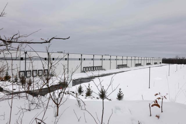 People protest against the planned project of converting a warehouse into a US Immigration and Customs Enforcement (ICE) detention center in Roxbury, New Jersey, on February 16, 2026. Activists say the Department of Homeland Security is considering converting this industrial warehouse into a US Immigration and Customs Enforcement (ICE) detention center which faces the opposition of the local community. (Photo by CHARLY TRIBALLEAU / AFP)