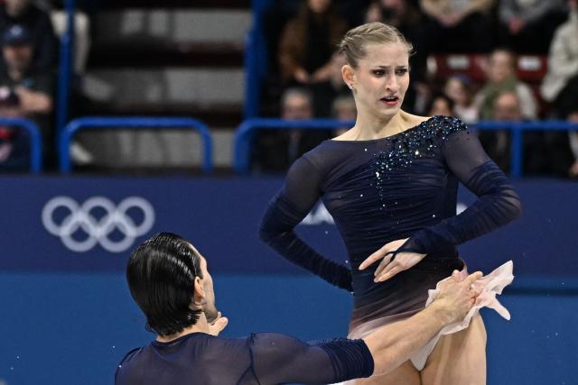 Germany's Minerva Fabienne Hase and Germany's Nikita Volodin compete in the figure skating pair skating free skating final during the Milano Cortina 2026 Winter Olympic Games at Milano Ice Skating Arena in Milan on February 16, 2026. (Photo by Gabriel BOUYS / AFP)