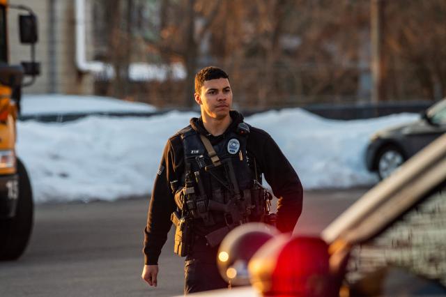 Police stand outside the perimeter they created around the Dennis M Lynch Arena where a shooting occurred earlier today in Pawtucket, Rhode Island, on February 16, 2026. At least two people were killed and three wounded in a shooting at an ice rink in the northeastern US town of Pawtucket on Monday, authorities said, with social media footage showing frightened teenagers fleeing the sound of gunshots. "We have three deceased. The suspect, and then we have two victims, and then we have three at the hospital," said Pawtucket police chief Tina Goncalves told reporters after the incident. She added that initial investigations suggested the shooting was targeted and "may be a family dispute." (Photo by Joseph Prezioso / AFP)