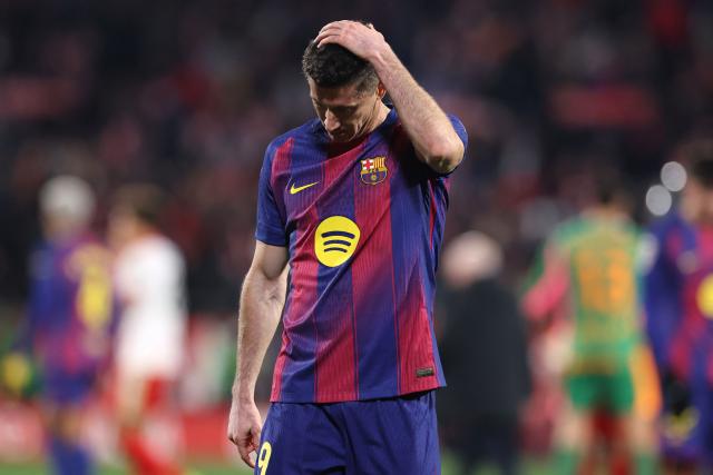 Barcelona's Polish forward #09 Robert Lewandowski reacts after losing during the Spanish league football match between Girona FC and FC Barcelona at Montilivi Stadium in Girona on February 16, 2026. (Photo by Josep LAGO / AFP)