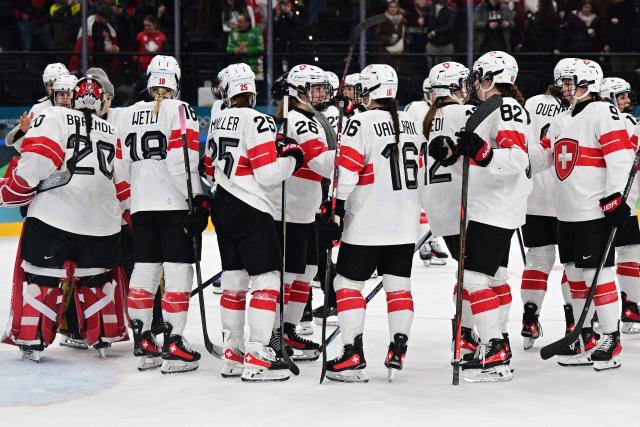 Switzerland's teammate react at the end of the women's play-off semi-final ice hockey match between Canada and Switzerland at the Milano Santagiulia Ice Hockey Arena during the Milano Cortina 2026 Winter Olympic Games in Milan, on February 16, 2026. Canada wins 2 - 1 against Switzerland and qualifies for the final. (Photo by Piero CRUCIATTI / AFP)