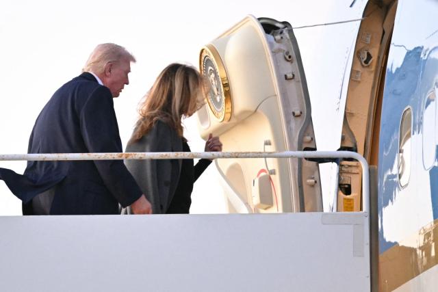 US President Donald Trump and First Lady Melania Trump make their way to board Air Force One before departing Palm Beach International Airport in West Palm Beach, Florida, on February 16, 2026. Trump is returning to Washington, DC, after spending the weekend at his Mar-a-Lago resort. (Photo by Mandel NGAN / AFP)