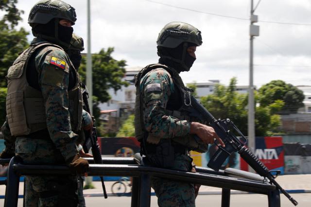 Members of the Armed Forces patrol the streets in Manta, Ecuador, on February 16, 2026. (Photo by Gerardo MENOSCAL / AFP)