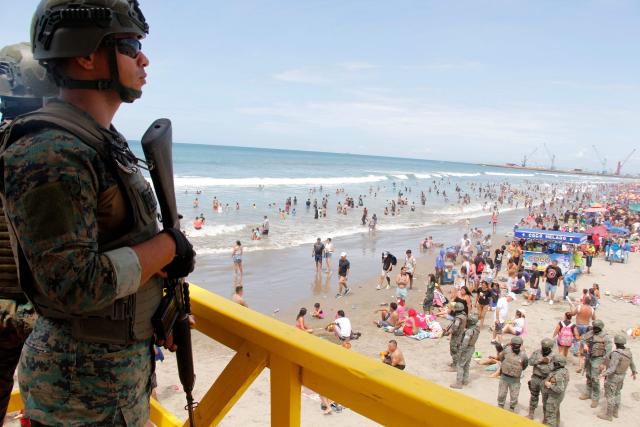 Members of the Armed Forces guard Jaramijo Beach in Manta, Ecuador, on February 16, 2026. (Photo by Gerardo MENOSCAL / AFP)