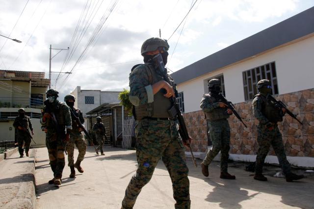 Members of the Armed Forces patrol the streets in Manta, Ecuador, on February 16, 2026. (Photo by Gerardo MENOSCAL / AFP)