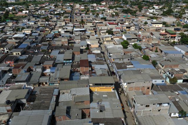 Aerial view of the La Pradera neighborhood in Manta, Ecuador, on February 16, 2026. (Photo by Gerardo MENOSCAL / AFP)