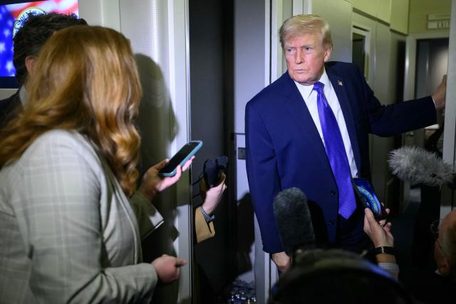 US President Donald Trump speaks to reporters while in flight on Air Force One, en route Joint Base Andrews from West Palm Beach, Florida on February 16, 2026. (Photo by Mandel NGAN / AFP)