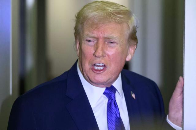 US President Donald Trump speaks to reporters while in flight on Air Force One, en route Joint Base Andrews from West Palm Beach, Florida on February 16, 2026. (Photo by Mandel NGAN / AFP)
