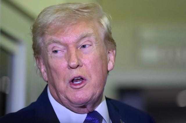 US President Donald Trump speaks to reporters while in flight on Air Force One, en route Joint Base Andrews from West Palm Beach, Florida on February 16, 2026. (Photo by Mandel NGAN / AFP)