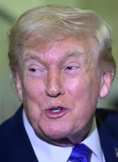 US President Donald Trump speaks to reporters while in flight on Air Force One, en route Joint Base Andrews from West Palm Beach, Florida on February 16, 2026. (Photo by Mandel NGAN / AFP)