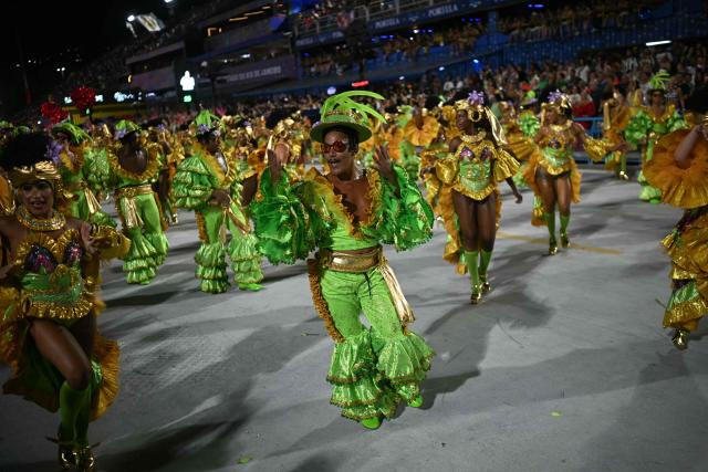 Revellers of the Mocidade Independente de Padre Miguel samba school perform during the second night of the Rio Carnival at the Marques de Sapucai Sambadrome in Rio de Janeiro, Brazil on February 16, 2026. (Photo by Mauro PIMENTEL / AFP)