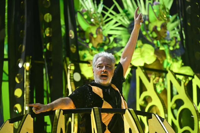 TOPSHOT - Brazilian composer Roberto de Carvalho, widower of Brazilian singer Rita Lee, performs on a float of the Mocidade Independente de Padre Miguel samba school during the second night of the Rio Carnival at the Marques de Sapucai Sambadrome in Rio de Janeiro, Brazil, on February 16, 2026. (Photo by Mauro PIMENTEL / AFP)