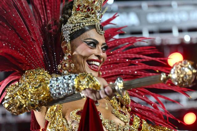 Brazilian actress Juliana Paes performs during the parade of the Unidos do Viradouro samba school on the second night of the Rio Carnival at the Marques de Sapucai Sambadrome in Rio de Janeiro, Brazil, early on February 17, 2026. (Photo by Mauro PIMENTEL / AFP)