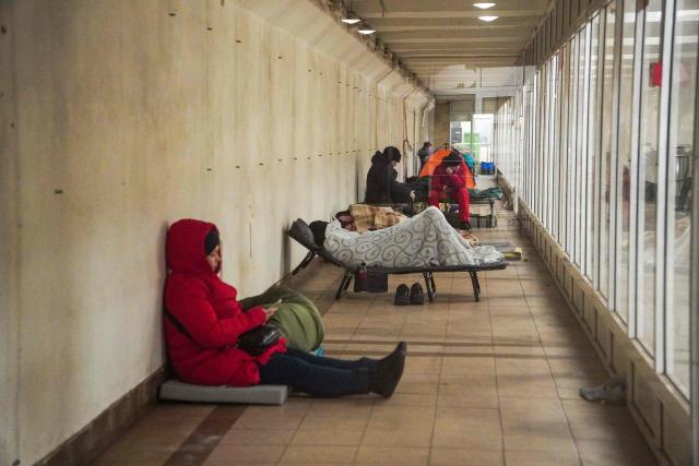 People take shelter at a metro station during an air raid alert, in Kyiv, early on February 17, 2026, amid the Russian invasion of Ukraine. (Photo by Serhii Okunev / AFP)