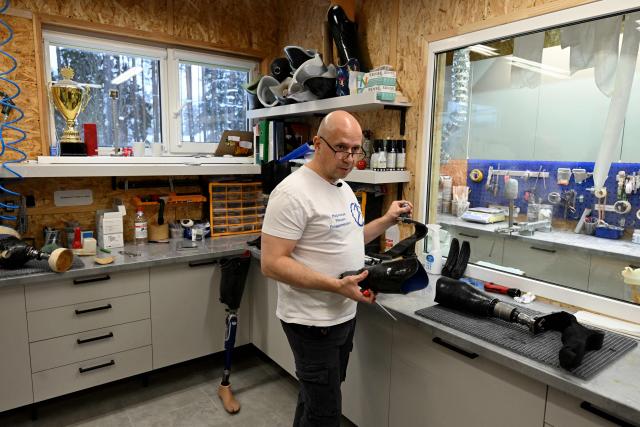 Mikhail Moskovtsev, 53, the private prosthetics workshop head, talks to AFP reporters at the studio's grounds in the Leningrad region on January 22, 2026. (Photo by Olga MALTSEVA / AFP)