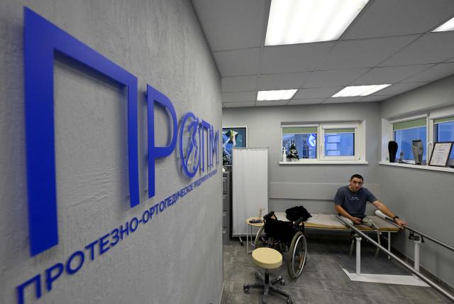 A patient visits the private prosthetics workshop in the Leningrad region on January 22, 2026. (Photo by Olga MALTSEVA / AFP)