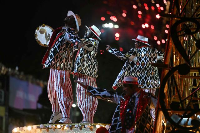 Revellers of the Unidos do Viradouro samba school perform during the second night of the Rio Carnival at the Marques de Sapucai Sambadrome in Rio de Janeiro, Brazil, early on February 17, 2026. (Photo by Mauro PIMENTEL / AFP)