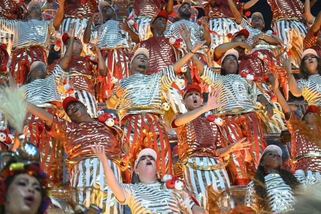 Revellers of the Unidos do Viradouro samba school perform during the second night of the Rio Carnival at the Marques de Sapucai Sambadrome in Rio de Janeiro, Brazil, early on February 17, 2026. (Photo by Mauro PIMENTEL / AFP)