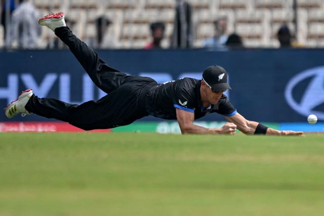 New Zealand's Cole McConchie dives to field the ball during the 2026 ICC Men's T20 Cricket World Cup group stage match between Canada and New Zealand at the MA Chidambaram Stadium in Chennai on February 17, 2026. (Photo by R. Satish BABU / AFP)