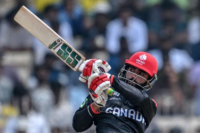 Canada's Yuvraj Samra watches the ball after playing a shot during the 2026 ICC Men's T20 Cricket World Cup group stage match between Canada and New Zealand at the MA Chidambaram Stadium in Chennai on February 17, 2026. (Photo by R. Satish BABU / AFP)