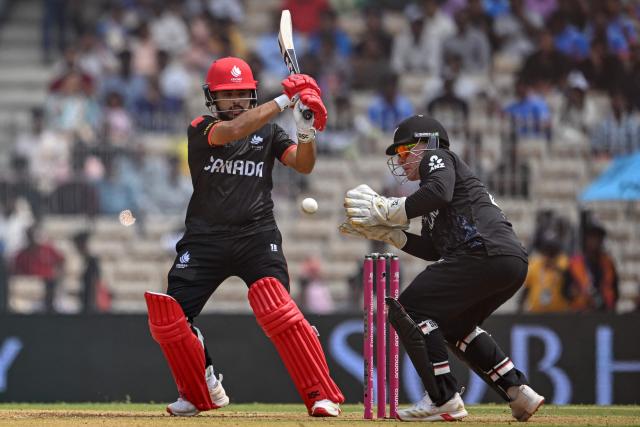 Canada's captain Dilpreet Bajwa (L) plays a shot as New Zealand's wicketkeeper Tim Seifert  reacts during the 2026 ICC Men's T20 Cricket World Cup group stage match between Canada and New Zealand at the MA Chidambaram Stadium in Chennai on February 17, 2026. (Photo by R. Satish BABU / AFP)
