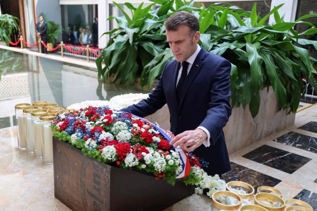 France's President Emmanuel Macron pays tribute at a memorial ceremony for the victims of the 2008 terrorist attacks, at the Taj Mahal Palace Hotel in Mumbai on February 17, 2026. (Photo by Ludovic MARIN / AFP)